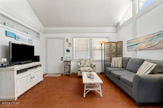 208 3rd St Unit 1/2, Panama City Beach, FL 32413 - living area featuring high vaulted ceiling