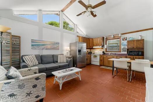 208 3rd St Unit 1/2, Panama City Beach, FL 32413 - living area with ceiling fan and high vaulted ceiling