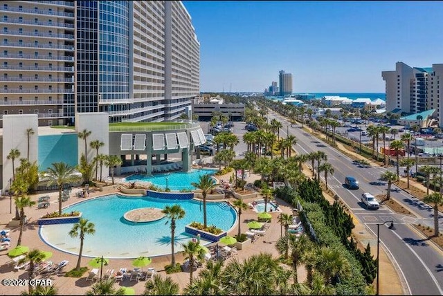 view of swimming pool featuring a city view