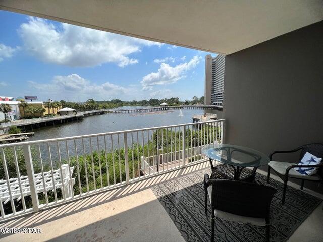 balcony featuring a water view