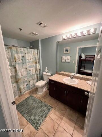 full bath with toilet, tile patterned flooring, vanity, and visible vents