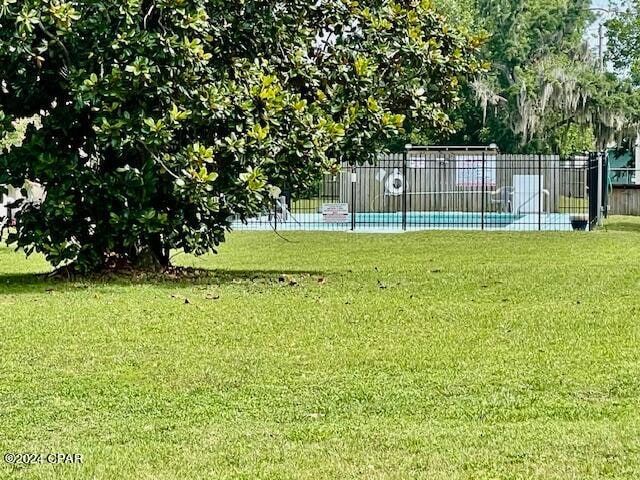 view of yard featuring a community pool