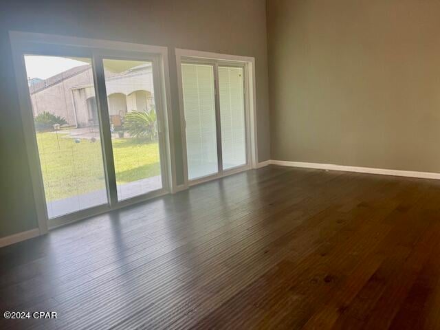 empty room featuring dark hardwood / wood-style floors