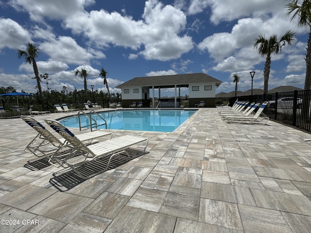 view of swimming pool featuring a patio area