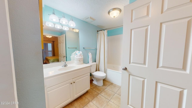 full bathroom featuring toilet, tile flooring, large vanity, shower / bath combo with shower curtain, and a textured ceiling