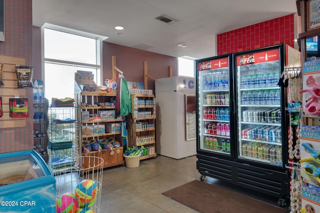 interior space with tile flooring and plenty of natural light