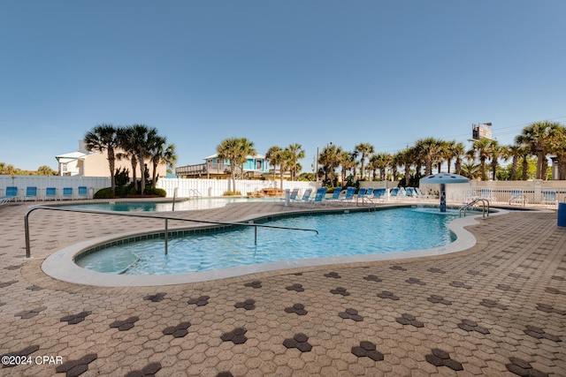 view of swimming pool with a patio area