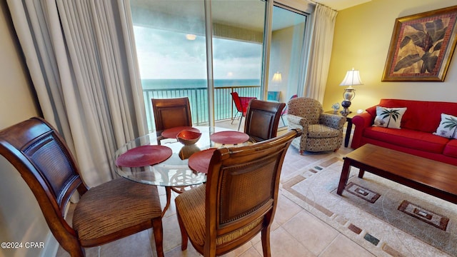 tiled dining area with a water view