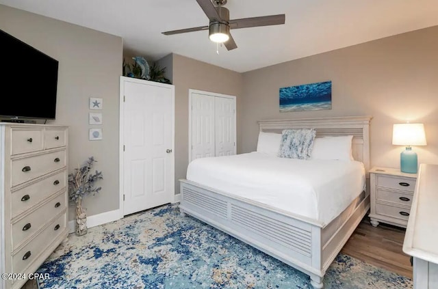 bedroom featuring a closet, hardwood / wood-style floors, and ceiling fan