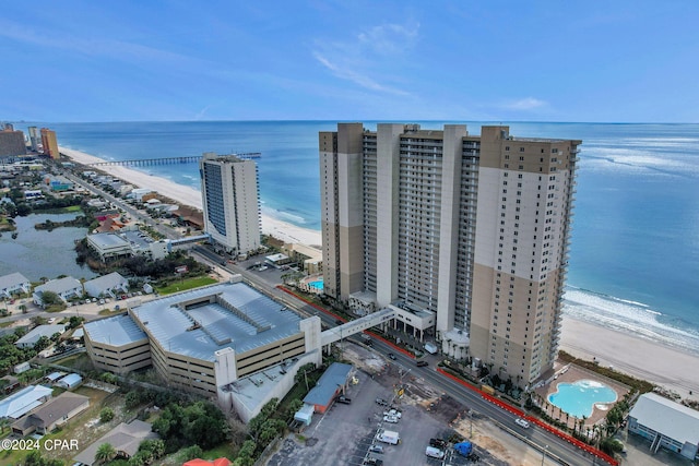 bird's eye view featuring a beach view and a water view