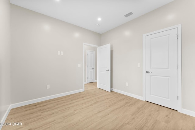 unfurnished bedroom with light hardwood / wood-style floors