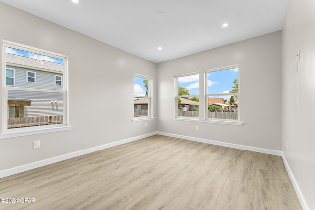 empty room with light hardwood / wood-style floors