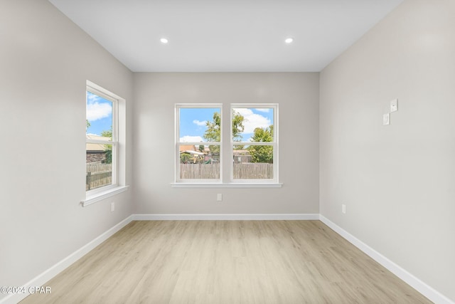 spare room featuring light wood-type flooring