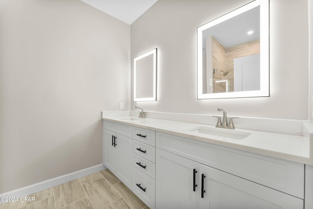 bathroom with tile patterned floors and dual bowl vanity