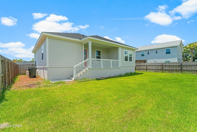 back of house with a yard