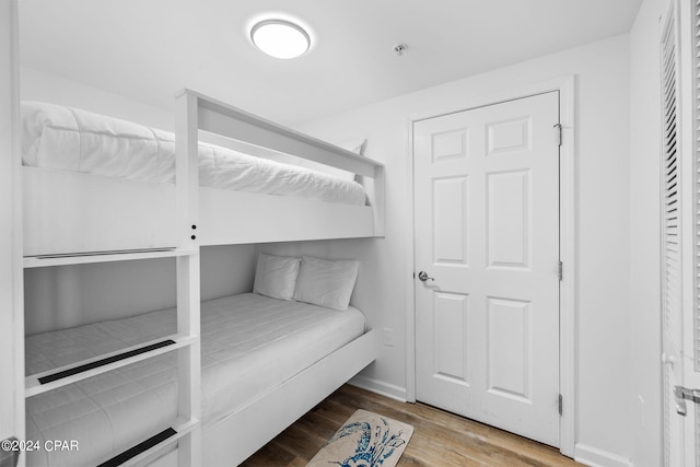 bedroom with wood-type flooring