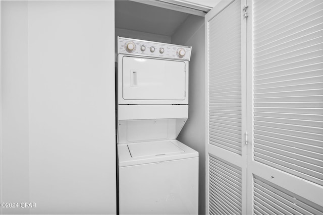 laundry room featuring stacked washer and clothes dryer