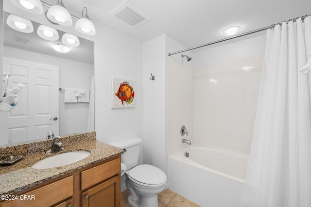 full bathroom with tile flooring, oversized vanity, toilet, and shower / bath combo