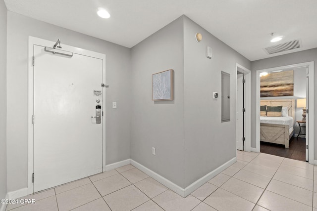 tiled entryway with electric panel