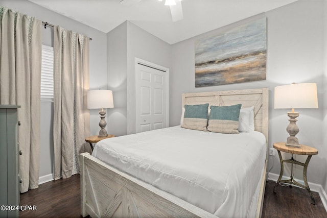 bedroom with a closet, dark hardwood / wood-style floors, and ceiling fan