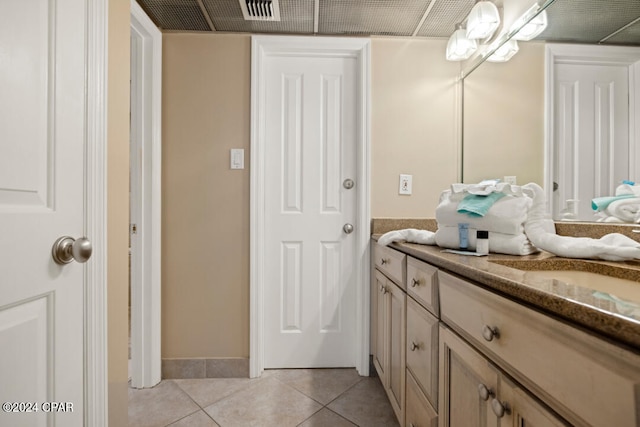 bathroom with vanity and tile patterned flooring