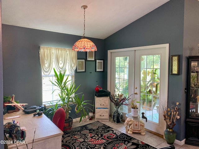 home office featuring lofted ceiling, french doors, and light tile patterned floors