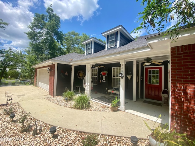 exterior space featuring ceiling fan and a garage