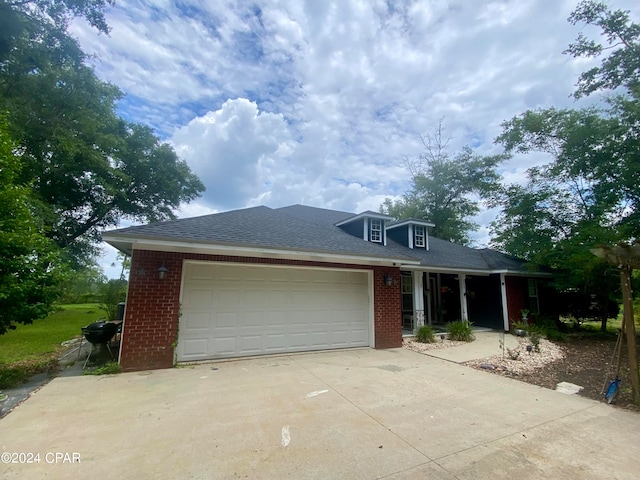 view of front of property with a garage