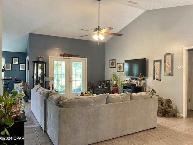 living room with high vaulted ceiling, french doors, light tile patterned floors, and ceiling fan