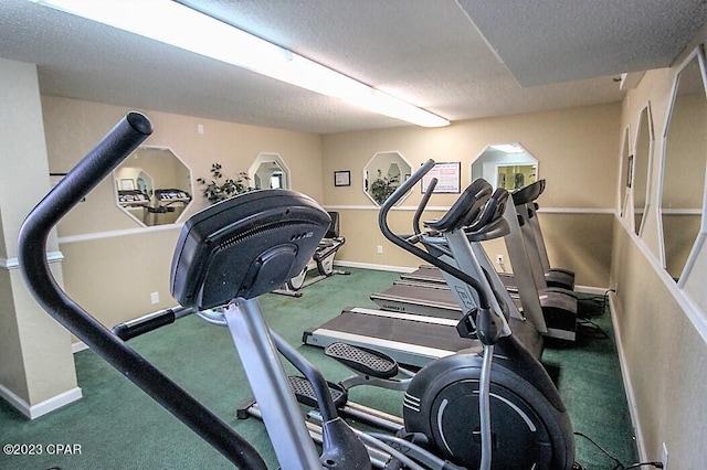 gym featuring a textured ceiling