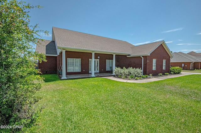 ranch-style house featuring a front lawn