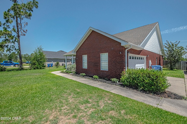 view of property exterior featuring a yard and a garage