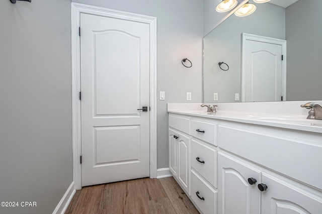 bathroom featuring vanity and wood-type flooring