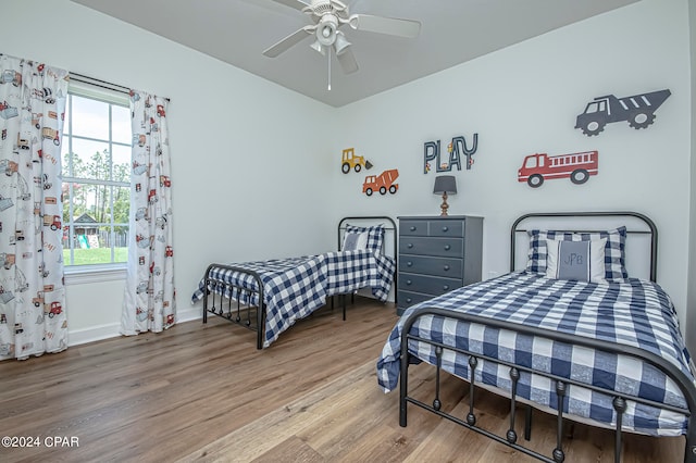 bedroom with ceiling fan and hardwood / wood-style floors