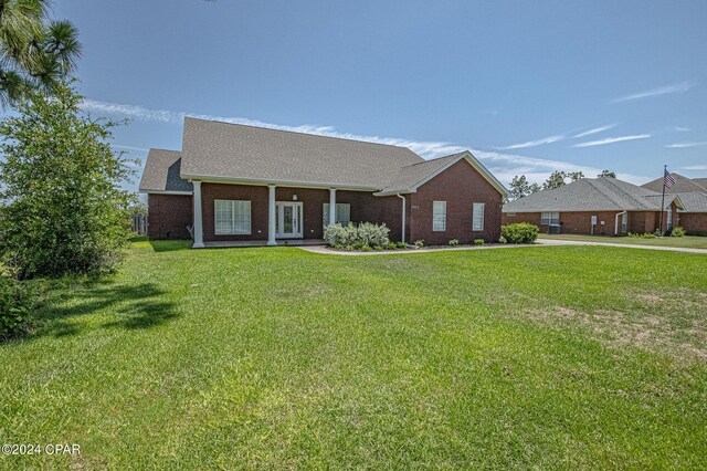 ranch-style home with a front yard