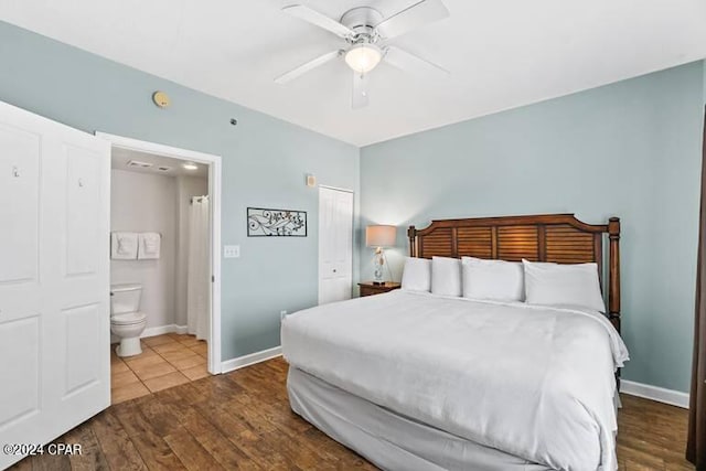 bedroom with ceiling fan, hardwood / wood-style flooring, and connected bathroom