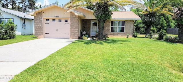 ranch-style house featuring a garage and a front yard