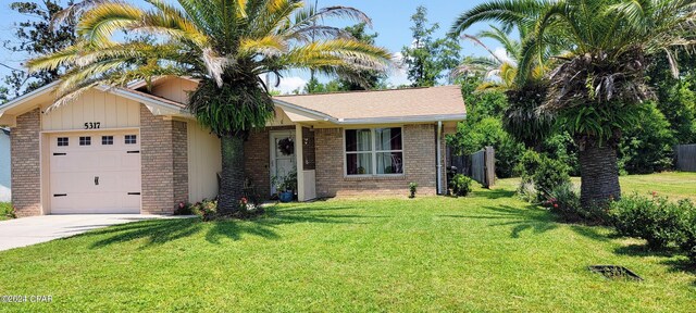 view of front facade featuring a garage and a front lawn