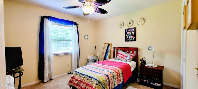 carpeted bedroom featuring ceiling fan