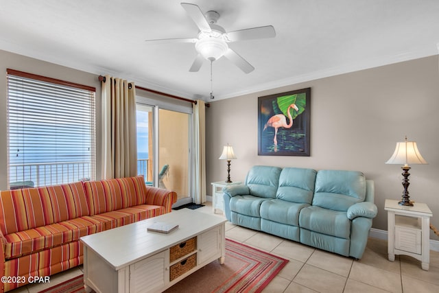 living room featuring ornamental molding, light tile patterned floors, and ceiling fan