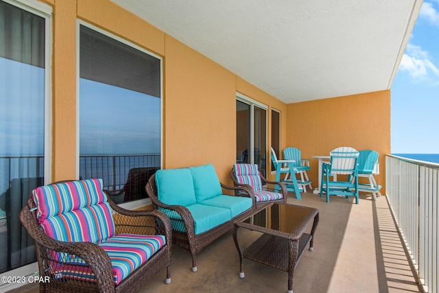 balcony featuring a water view