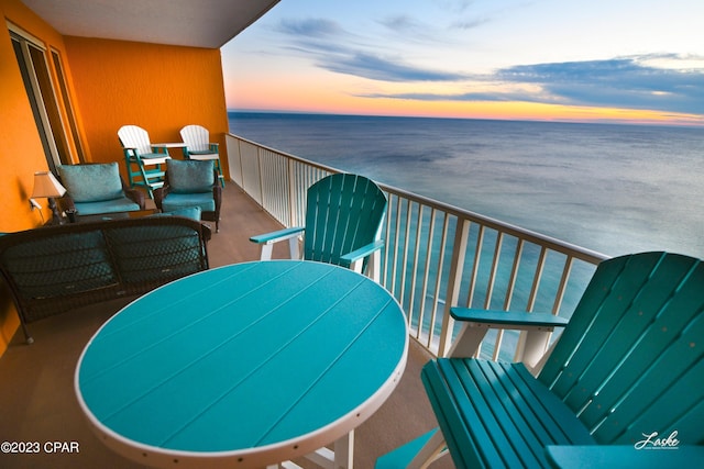 balcony at dusk with a water view