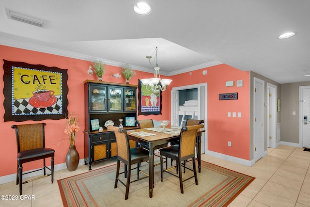 tiled dining area with ornamental molding and an inviting chandelier