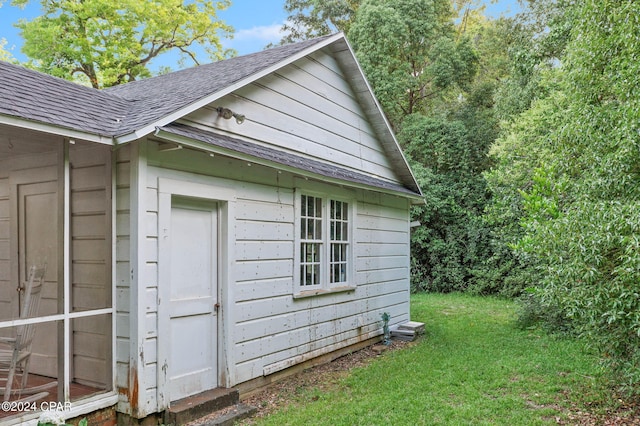 view of home's exterior with a yard