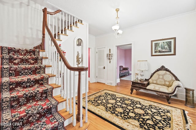 703 N Waukesha St, Bonifay, FL 32425 - staircase with wood finished floors, crown molding, and baseboards
