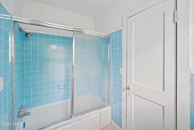703 N Waukesha St, Bonifay, FL 32425 - bathroom featuring bath / shower combo with glass door