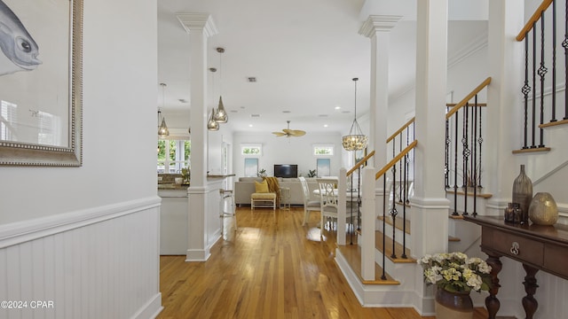 foyer entrance featuring light wood-type flooring and crown molding