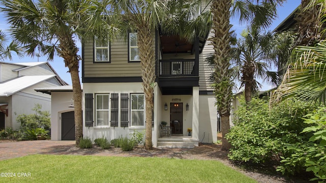 view of front of property with a front lawn and a garage