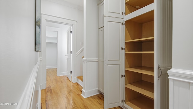 hallway with light hardwood / wood-style flooring