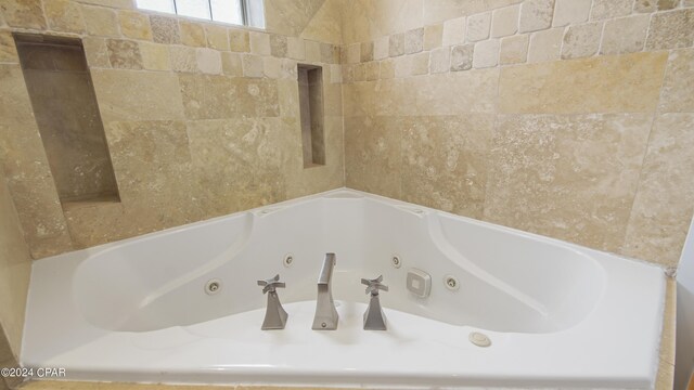 bathroom featuring a tub